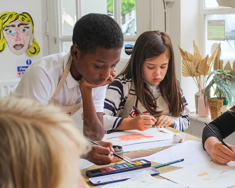 Children are sketching their dream sushi designs
